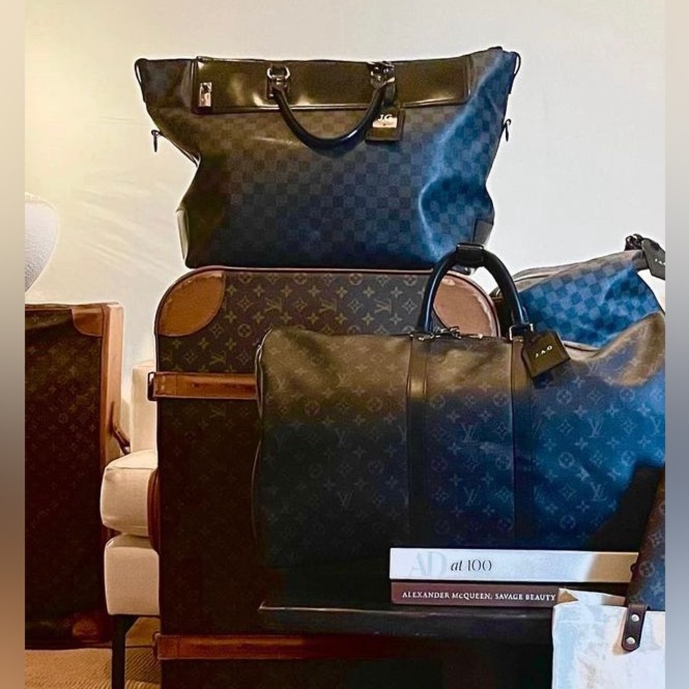 Vintage Louis Vuitton luggage with working original zippers and buckles.